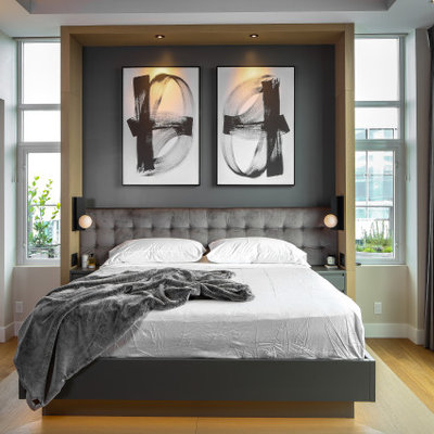 Inspiration for a mid-sized contemporary master medium tone wood floor and brown floor bedroom remodel in Vancouver with beige walls