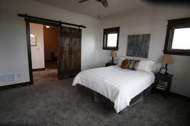 Inspiration for a mid-sized transitional master carpeted and gray floor bedroom remodel in Other with white walls and no fireplace