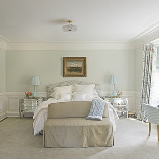 Elegant bedroom photo in New York with gray walls