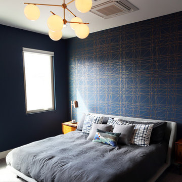 Sneak Peek: Navy and Copper Wall Paper Master Bedroom with Brass Chandelier