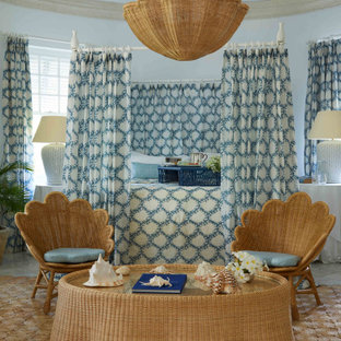 Design ideas for a large coastal master bedroom in London with blue walls and grey floors.