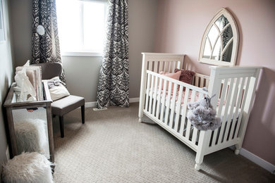 Design ideas for a large rustic nursery in Edmonton with beige walls and carpet.