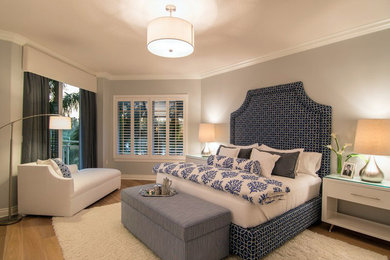 This is an example of a contemporary bedroom in Tampa with beige walls.