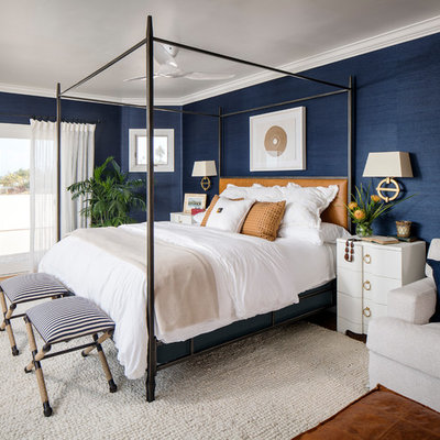 Example of a mid-sized beach style master bedroom design in San Francisco with blue walls
