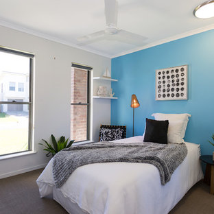 Inspiration for a transitional bedroom in Brisbane with blue walls and no fireplace.