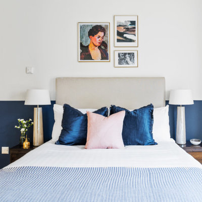 Inspiration for a contemporary bedroom remodel in London with blue walls