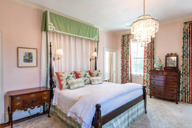 Inspiration for a timeless master carpeted and beige floor bedroom remodel in Charleston with pink walls