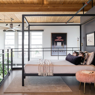 Foto de dormitorio tipo loft, actual, con paredes negras, suelo de cemento y suelo gris