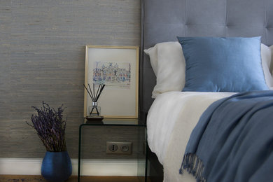 Medium sized contemporary master bedroom in Nice with multi-coloured walls and medium hardwood flooring.
