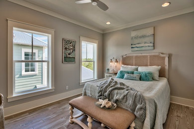 Mid-sized elegant light wood floor bedroom photo in Miami with no fireplace and gray walls
