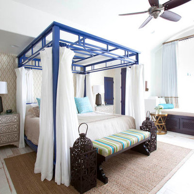 Bedroom - mediterranean painted wood floor bedroom idea in Houston with beige walls and no fireplace