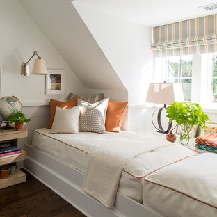 This is an example of a nautical bedroom in Charlotte with white walls, dark hardwood flooring and brown floors.
