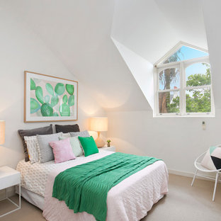 Photo of a small contemporary guest bedroom in Sydney with white walls, carpet and beige floor.