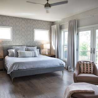 Bedroom - mid-sized transitional master vinyl floor and brown floor bedroom idea in Other with gray walls, a standard fireplace and a stone fireplace