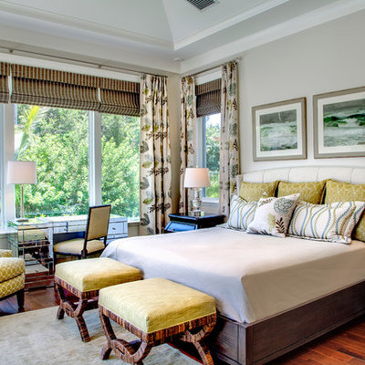 Example of an island style dark wood floor bedroom design in Tampa with gray walls