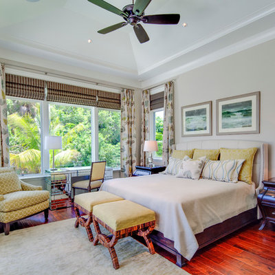 Island style red floor bedroom photo in Tampa with gray walls