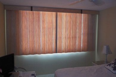 Split draw sliding woven wood treatments over a sliding glass window can be a ni