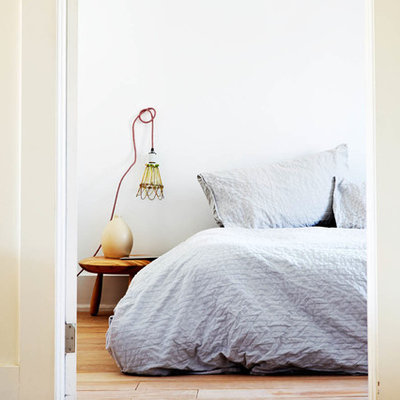 Bedroom - eclectic bedroom idea in Toronto with white walls
