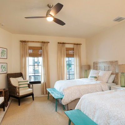 Bedroom - tropical guest bedroom idea in Charleston with beige walls