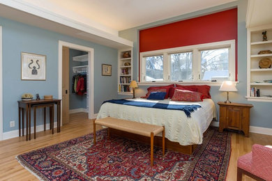 Bedroom - mid-sized transitional master light wood floor bedroom idea in Minneapolis with blue walls