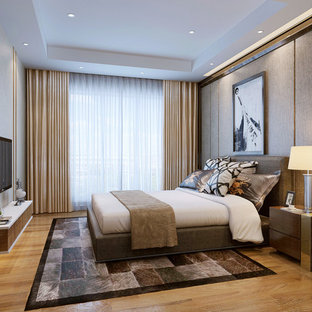 Imagen de habitación de invitados contemporánea, grande, con paredes multicolor y suelo de contrachapado