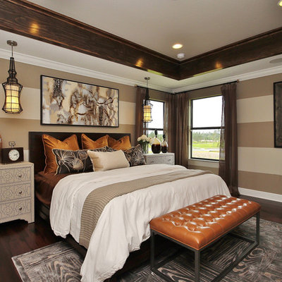 Example of a transitional dark wood floor bedroom design in Orlando with brown walls and no fireplace