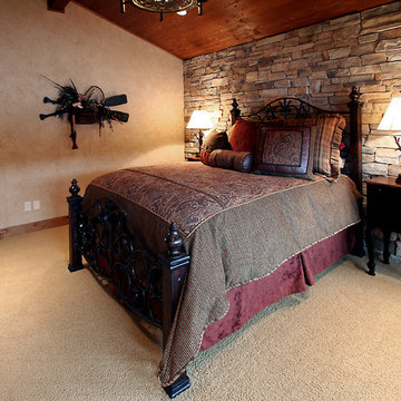 Stone accent walled bedroom