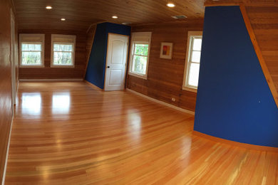 Example of a large farmhouse master light wood floor bedroom design in Sacramento