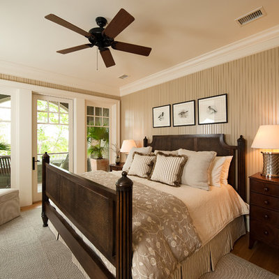Bedroom - mid-sized traditional guest medium tone wood floor bedroom idea in Charleston with beige walls