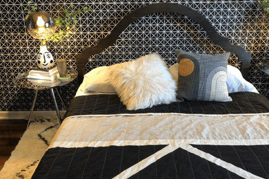 Bedroom - modern bedroom idea in Orange County with black walls