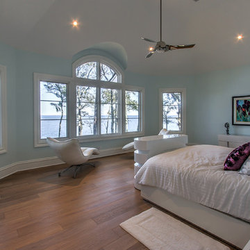 Stunning master bedroom designed with view in mind as TV is hidden in cabinet