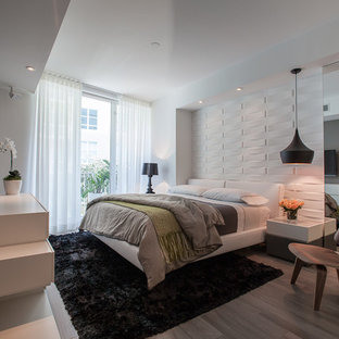 Bedroom - mid-sized modern master ceramic tile bedroom idea in Miami with white walls and no fireplace