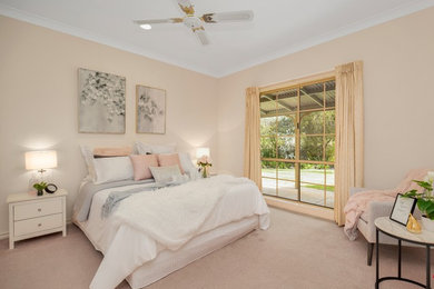 This is an example of a traditional grey and pink bedroom in Other.