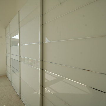 Stylish sliding door wardrobe in contemporary new build.