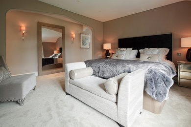 Design ideas for a contemporary grey and cream bedroom in London.