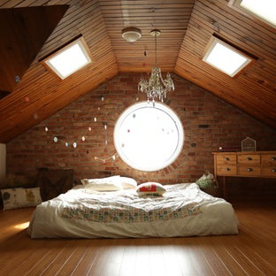 Design ideas for a transitional bedroom in Melbourne with white walls, medium hardwood floors and orange floor.