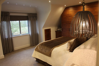 Design ideas for a modern bedroom in Surrey.
