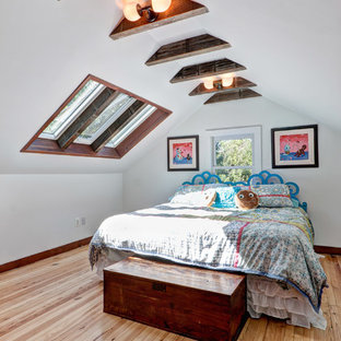 Inspiration for a craftsman light wood floor bedroom remodel in Philadelphia with white walls