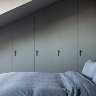Photo of a medium sized scandi guest bedroom in London with grey walls.