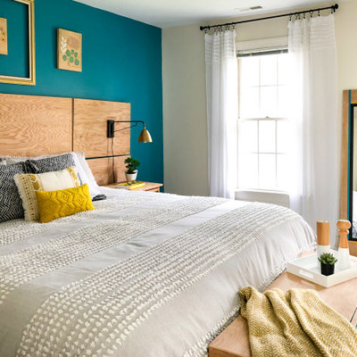 Trendy beige floor bedroom photo in Raleigh with blue walls