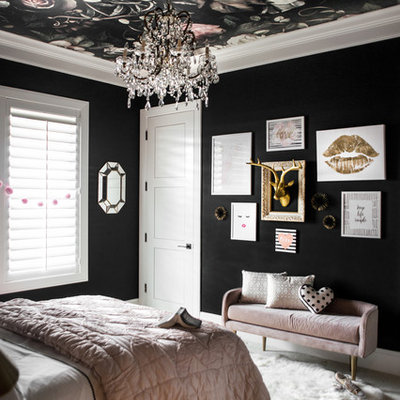 Example of a mid-sized eclectic carpeted bedroom design in Boise with black walls