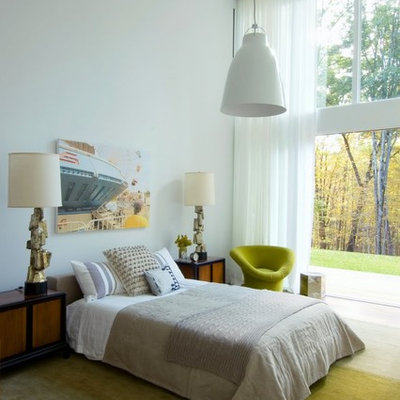 Example of an eclectic bedroom design in New York with white walls