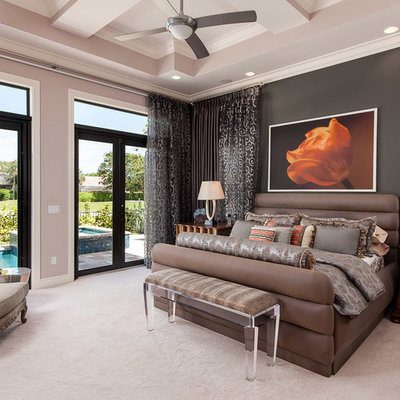 Large trendy master carpeted and beige floor bedroom photo in Miami with brown walls