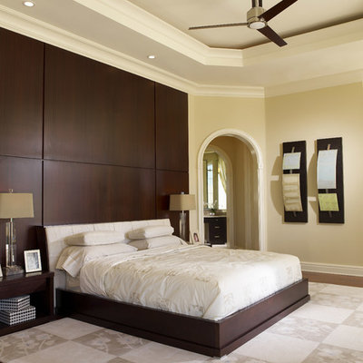 Bedroom - large contemporary master dark wood floor and brown floor bedroom idea in Tampa with beige walls and no fireplace