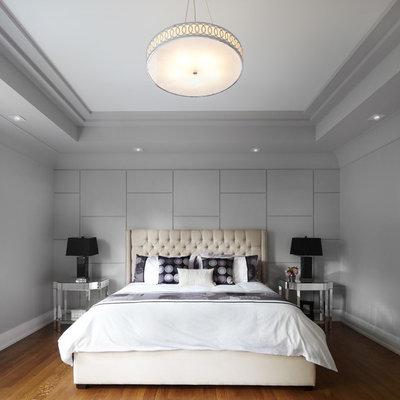 Inspiration for a contemporary medium tone wood floor bedroom remodel in Toronto with gray walls