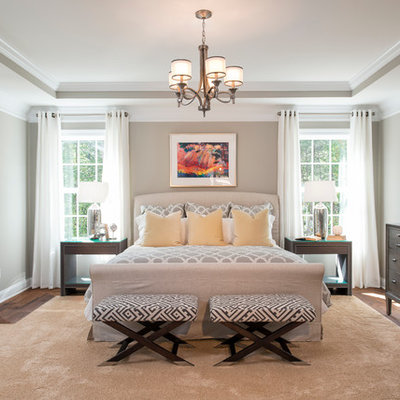 Inspiration for a timeless master medium tone wood floor bedroom remodel in DC Metro with gray walls