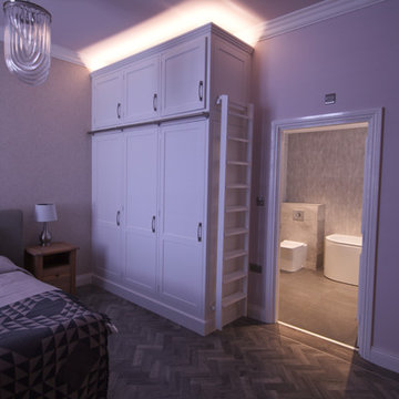 The ensuite with LED lighting above the wardrobes.