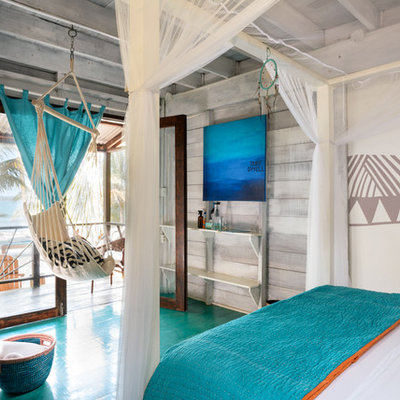 Inspiration for a tropical painted wood floor bedroom remodel in Other with multicolored walls