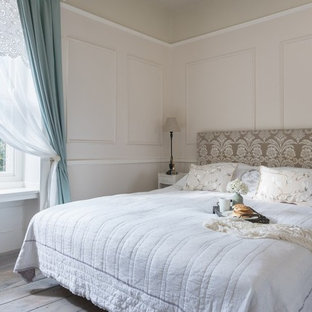 This is an example of a shabby-chic style bedroom in Gloucestershire with pink walls, dark hardwood flooring and brown floors.