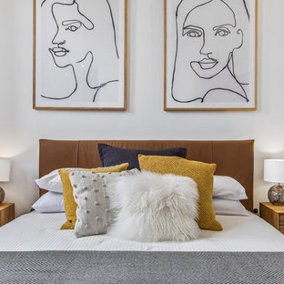 Contemporary bedroom in Melbourne with white walls.